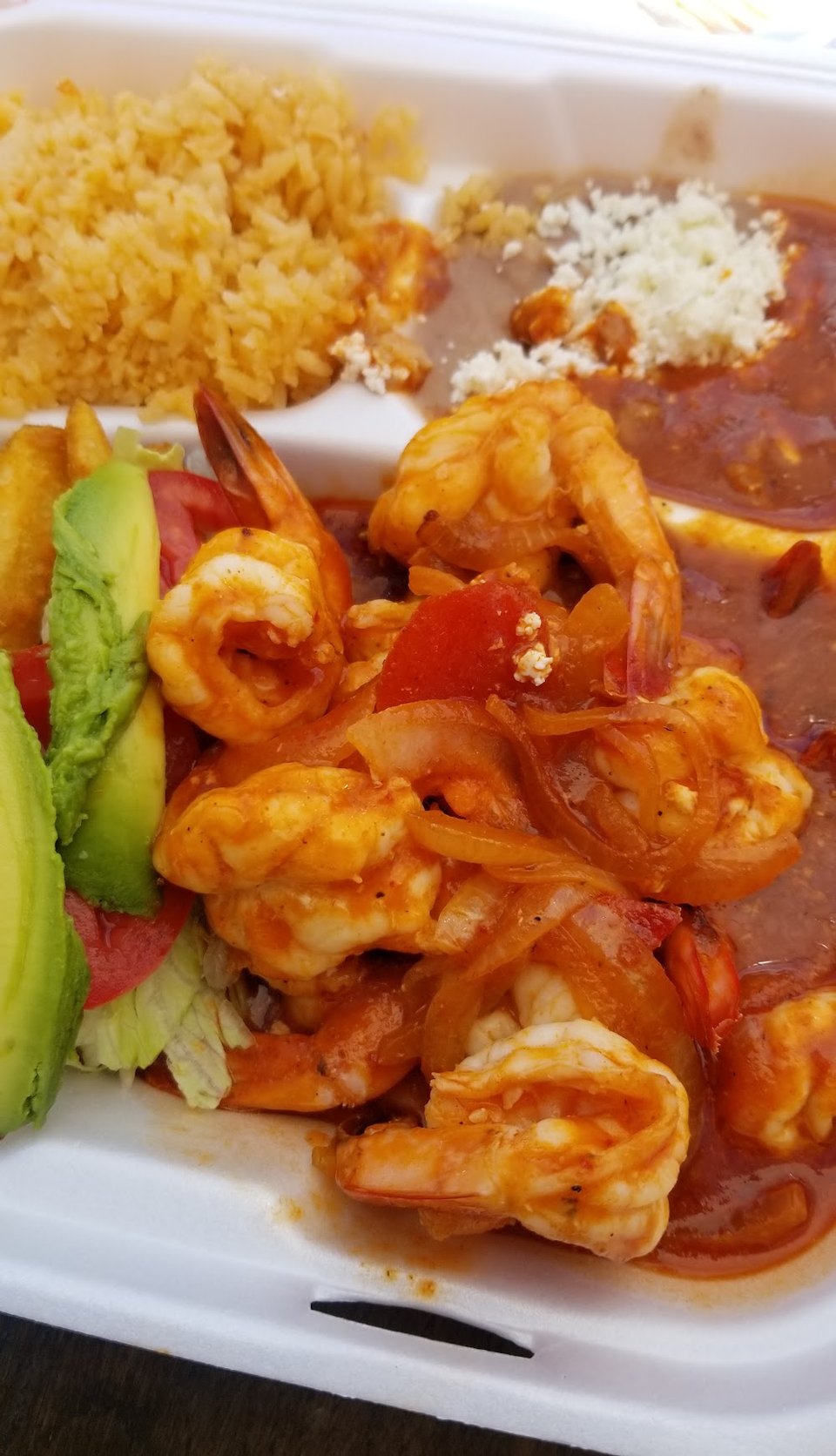 Counter menu featuring seafood cocktails and chilaquiles.