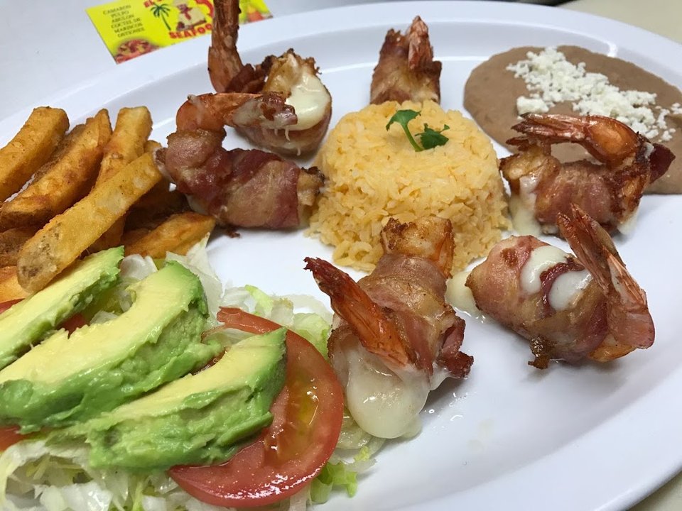 Restaurant menu highlighting Mexican breakfast and dinner plates.